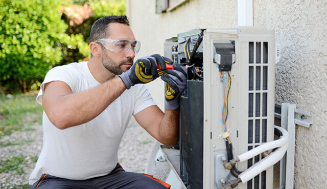 Image of Premier Air Servicing the Outdoor Coil
